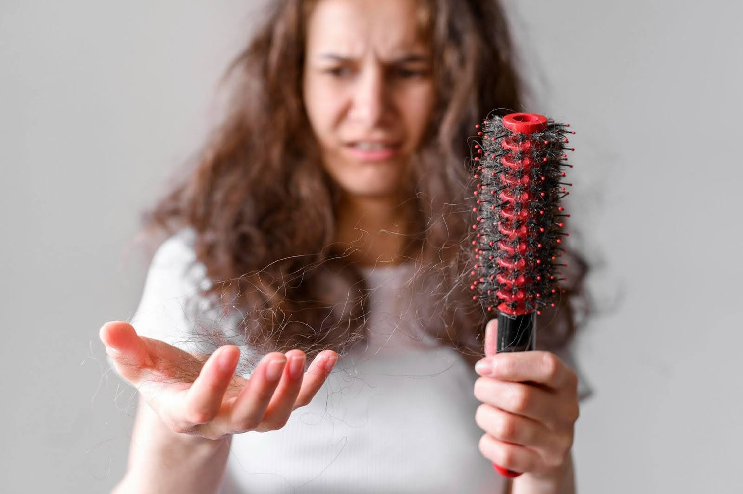 Women losing hair on hairbrush